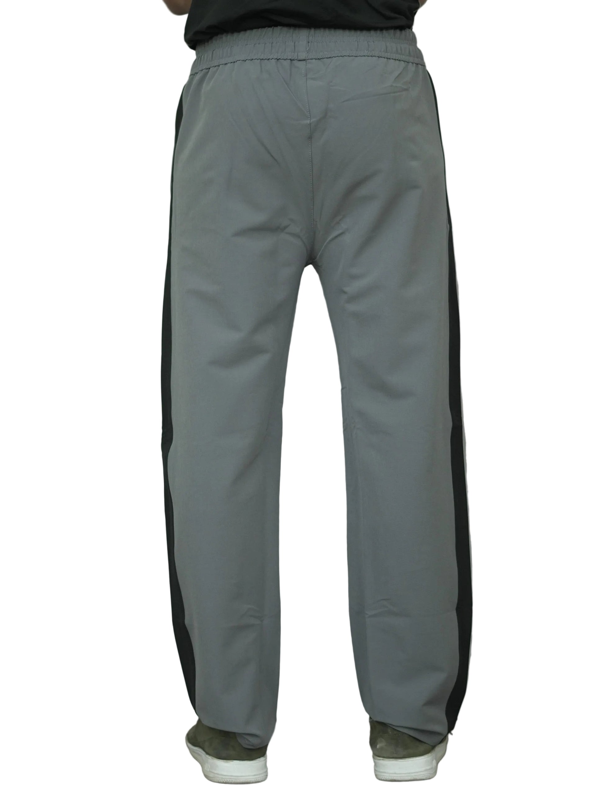Gray pants with black side panels on a white background